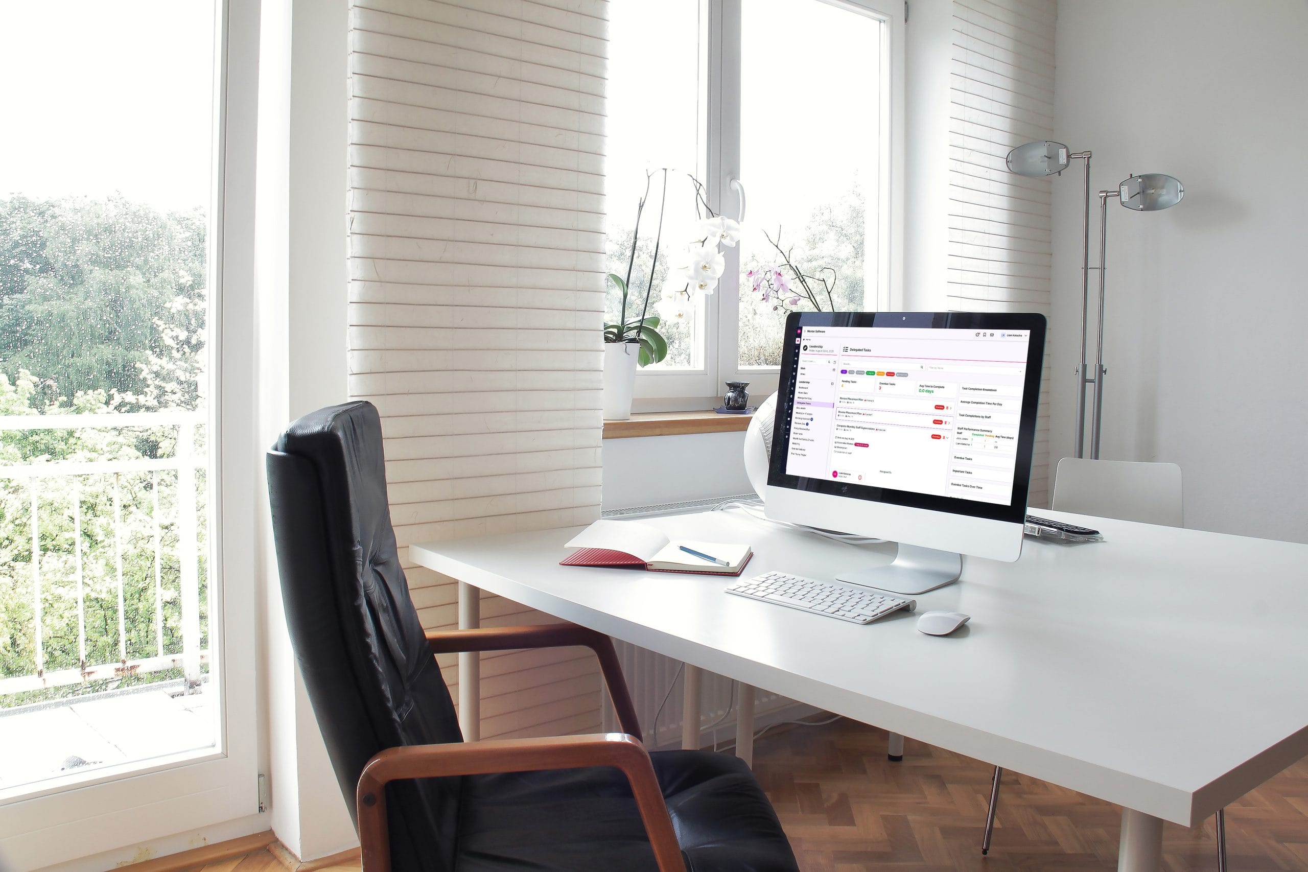 office desk with mentor software on an iMac