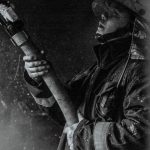 fire fighter putting out a fire holding a fire hose - Fire Safety