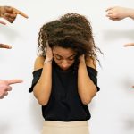 girl trying to blockout bullying